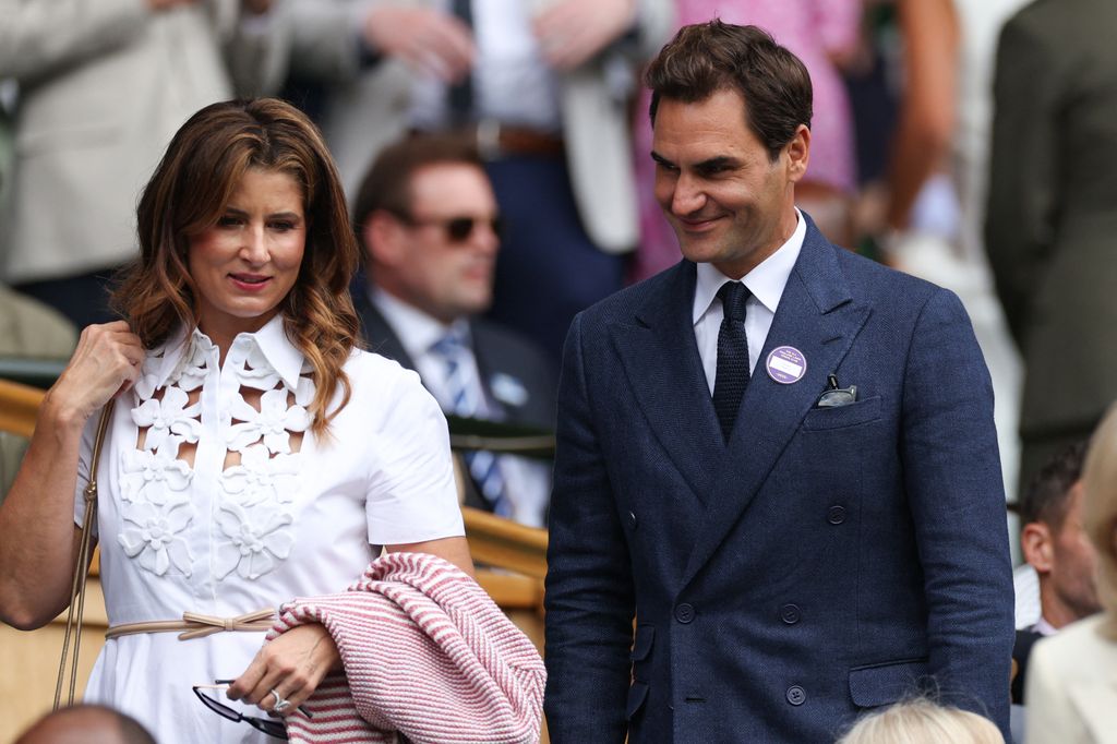 Roger Federer and his wife Mirka Federer arrive on the Royal box of Centre Court 