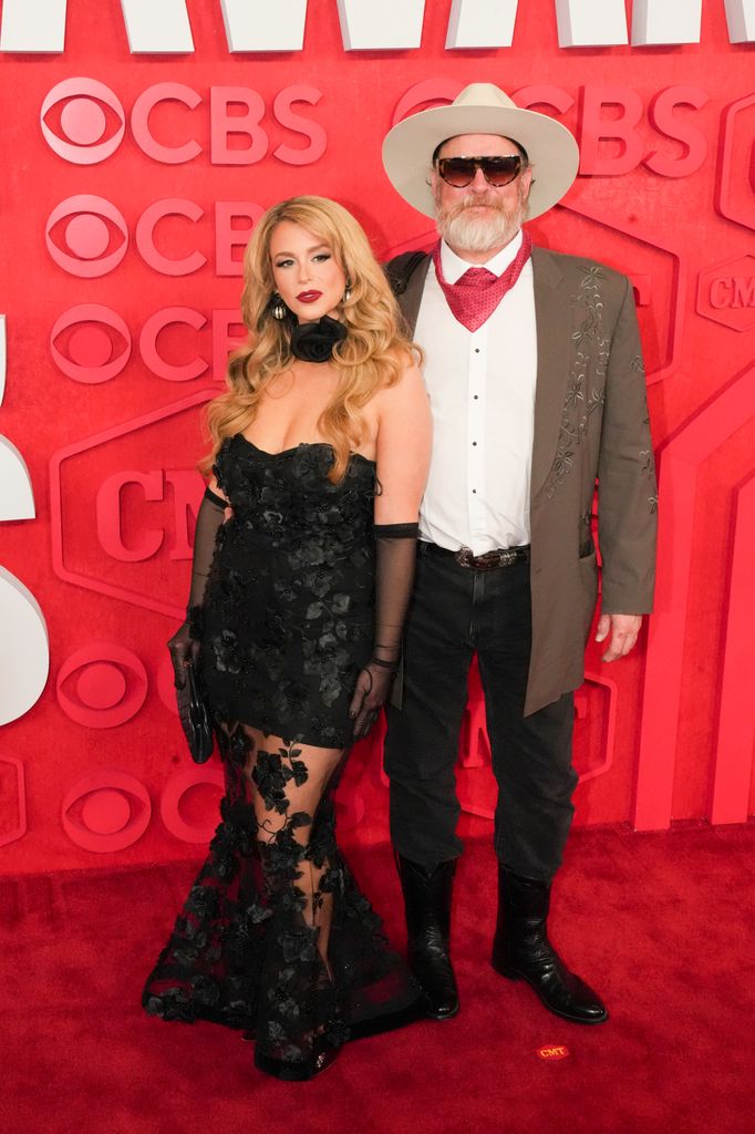 ana cristina cash in black lace dress and john carter cash on red carpet at cmt awards 2024