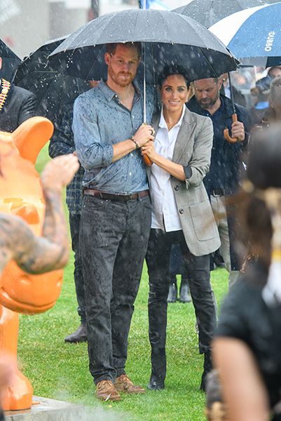 prince harry and meghan markle in the rain
