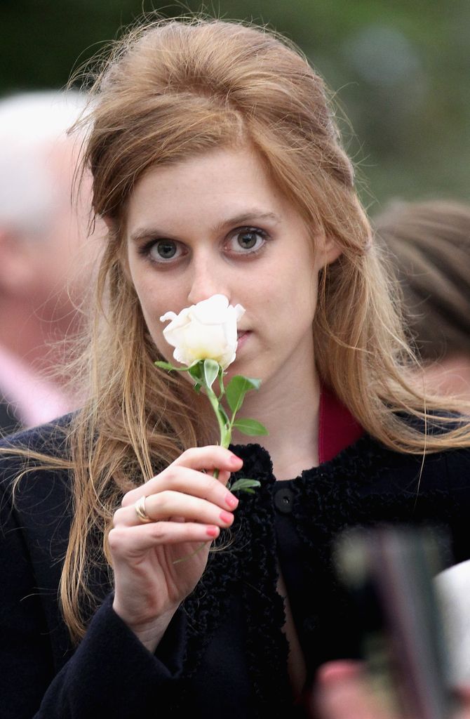  Princess Beatrice holds a rose she was presented as she visits the Chelsea Flower Show Press and VIP Day on May 23, 2011 in London, England.  