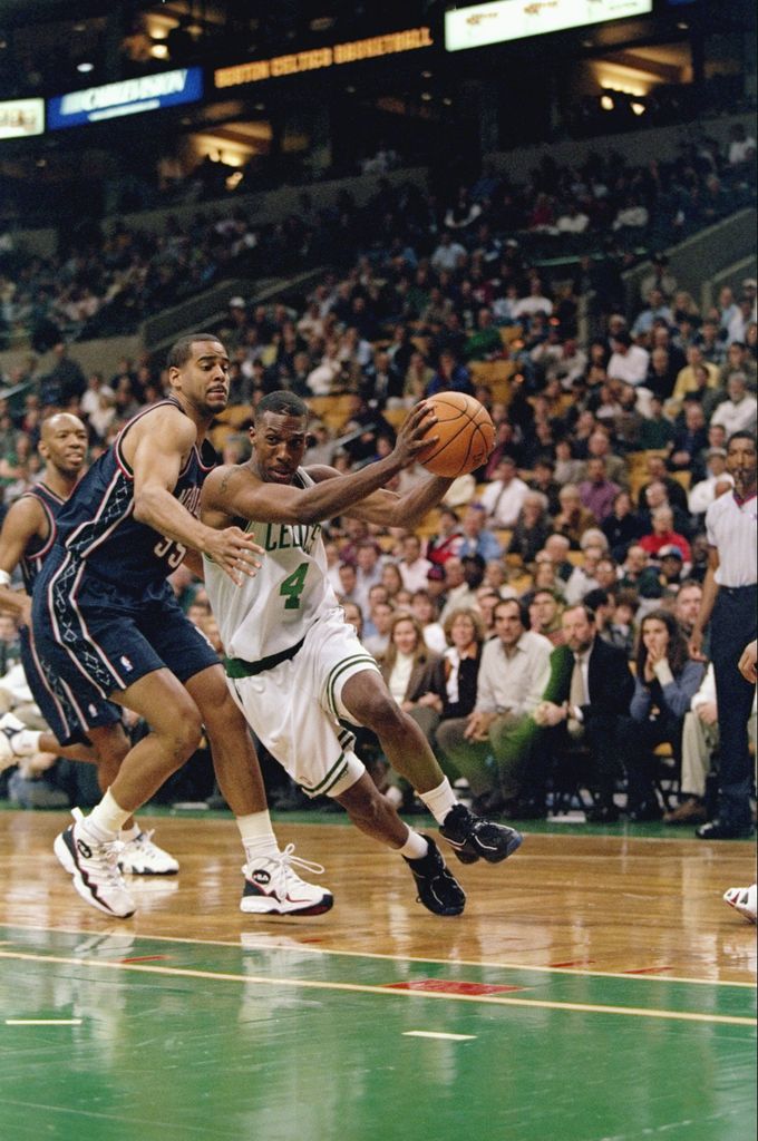 Guard Chauncey Billups of the Boston Celtics (right) in action against forward Jayson Williams of the New Jersey Nets during a game at the Fleet Center in Boston, Massachusetts. The Celtics won the game 101-93.