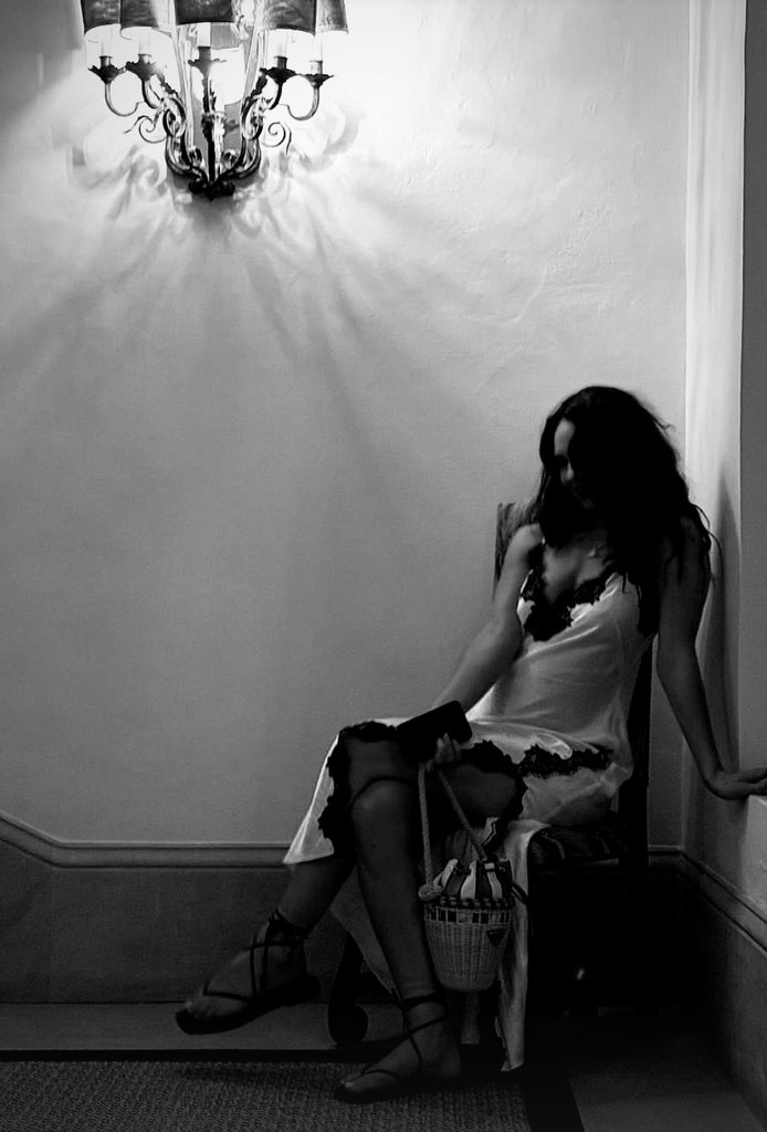 lily james in a black lace-trimmed gown