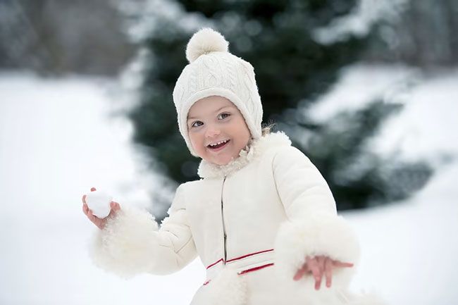 Princess Estelle of Sweden throws a snowball