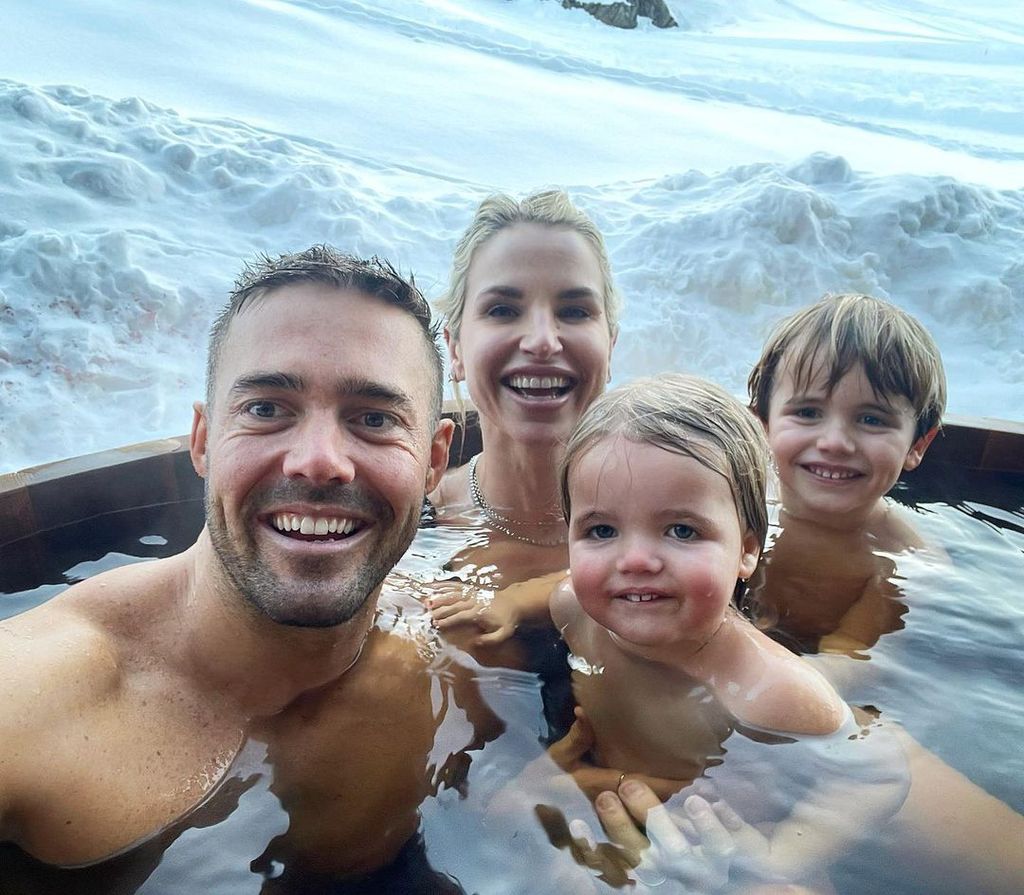 Spencer Matthews, Vogue Williams and two of their children in a hot tub 