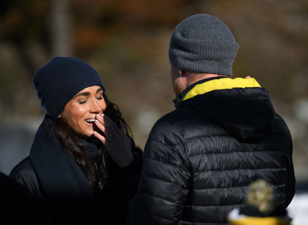 Meghan, Duchess of Sussex, greets Prince Harry after his skeleton run