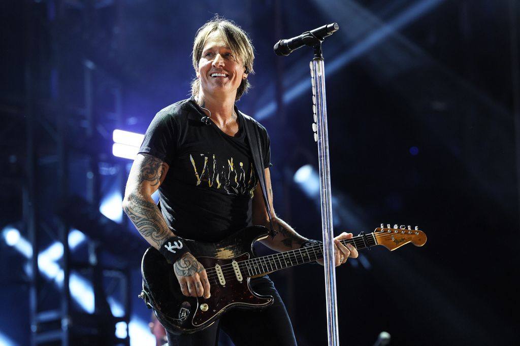 keith urban smiling onstage