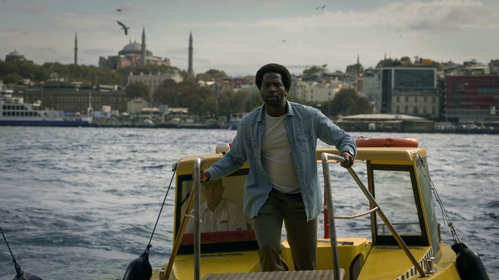 man standing on boat in sea