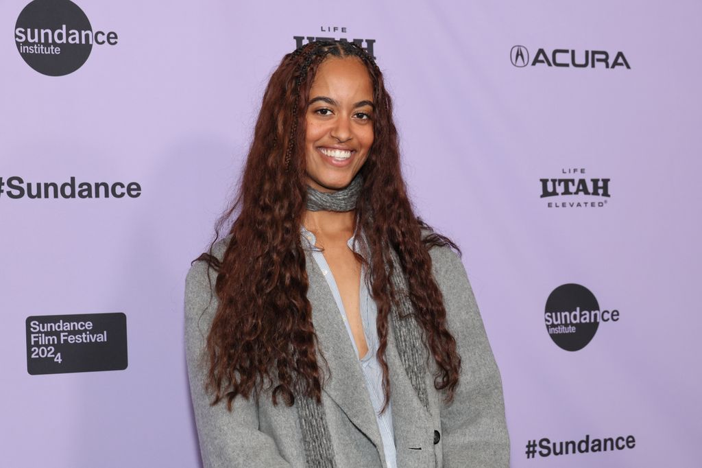 Malia Obama smiling on the red carpet at a premiere