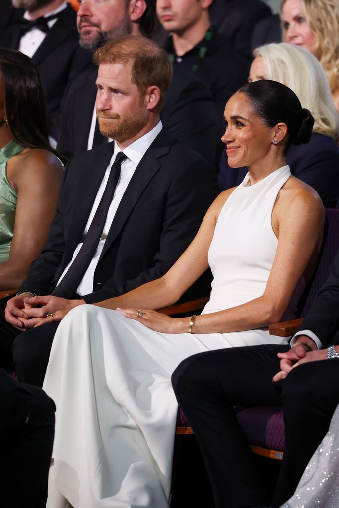 Meghan looked stunning in the cream gown alongside husband Prince Harry