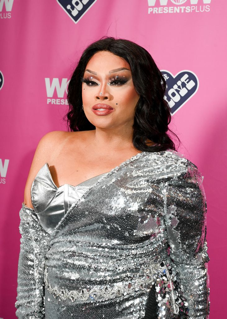 jiggly caliente in silver dress 