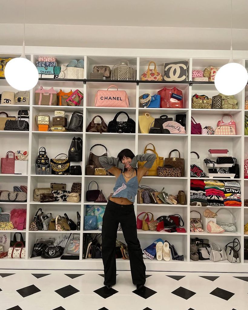 macy eleni in room full of bags