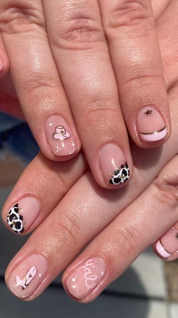 pink and nude western nails manicure with cows star and cowboy hat
