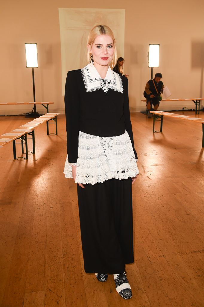 Lucy Boynton attended the Bora Aksu show in a black and white lace monochrome outfit from the brand. 
