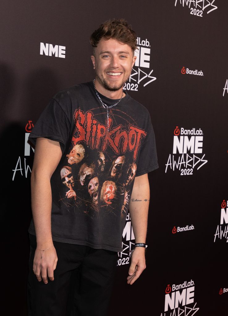 Roman Kemp smiling in a Slipknot tshirt