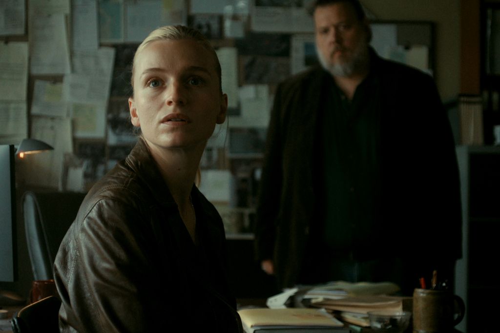 woman sitting on chair in office
