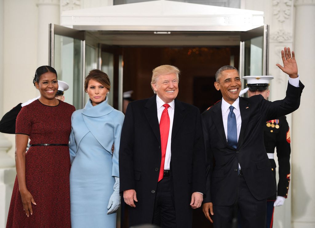 US President Barack Obama(R) and First Lady Michelle Obama(L) welcome President-elect Donald Trump(2nd-R) and his wife Melania to the White House in Washington, DC January 20, 2017