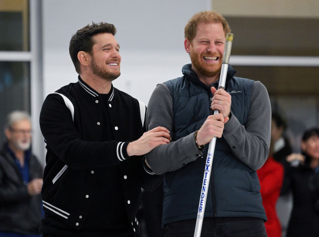 Michael Buble and Prince Harry laughing