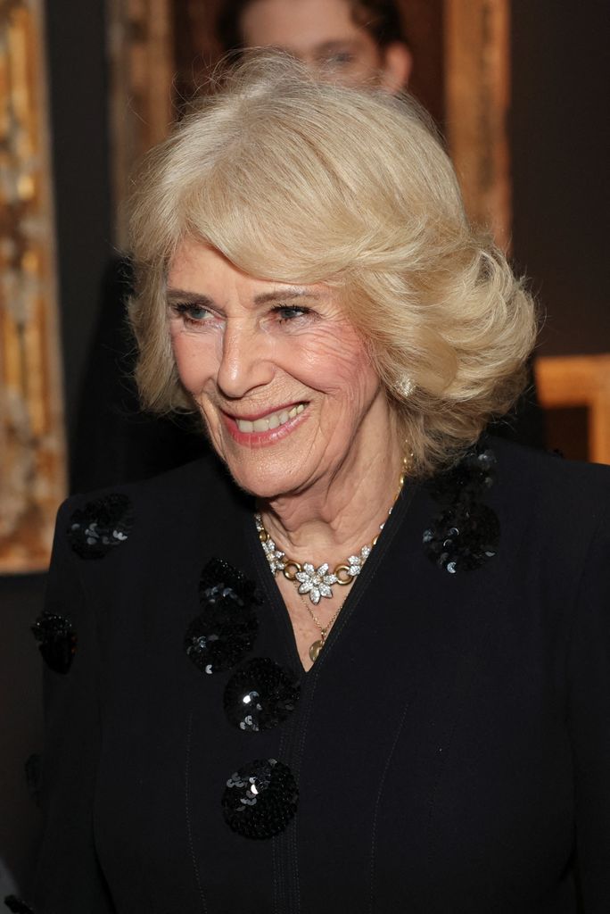 The Queen looked elegant in black with a floral necklace