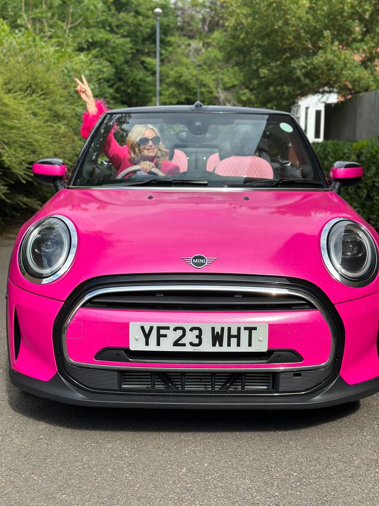 Leanne Bayley driving a pink mini