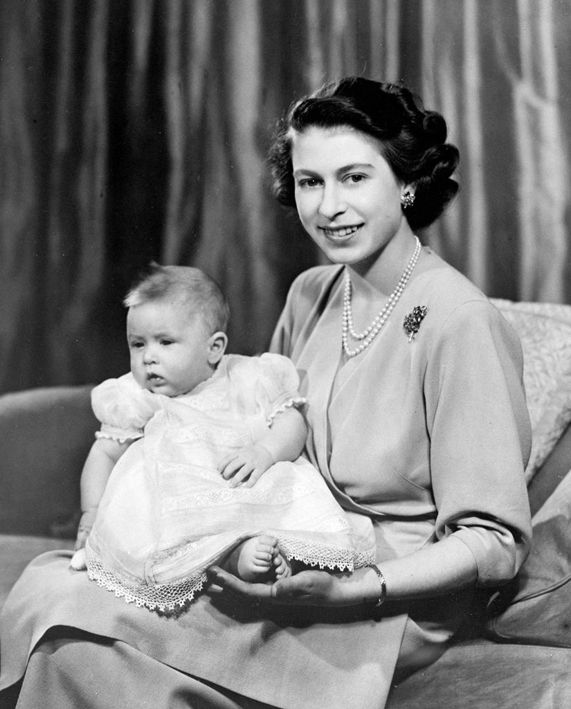 The Queen cradling her newborn Prince Charles