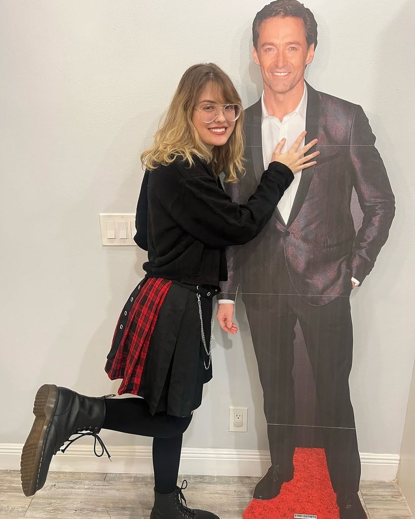 Dannielynn Birkhead poses beside her Hugh Jackman life-size cut-out for Christmas, shared on Instagram by dad Larry Birkhead