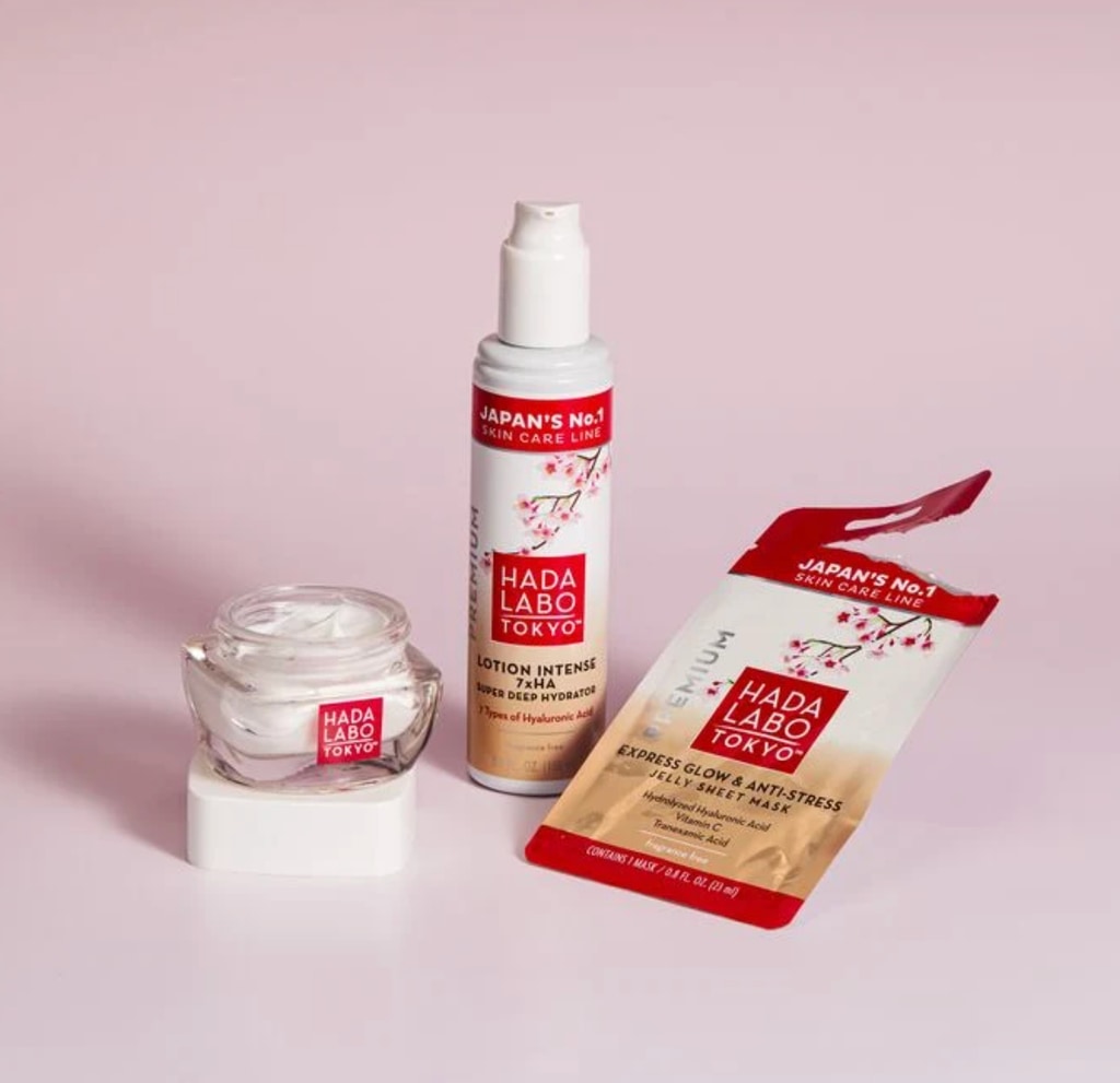 Hada Labo Tokyo night cream, lotion and sheet mask on pink background