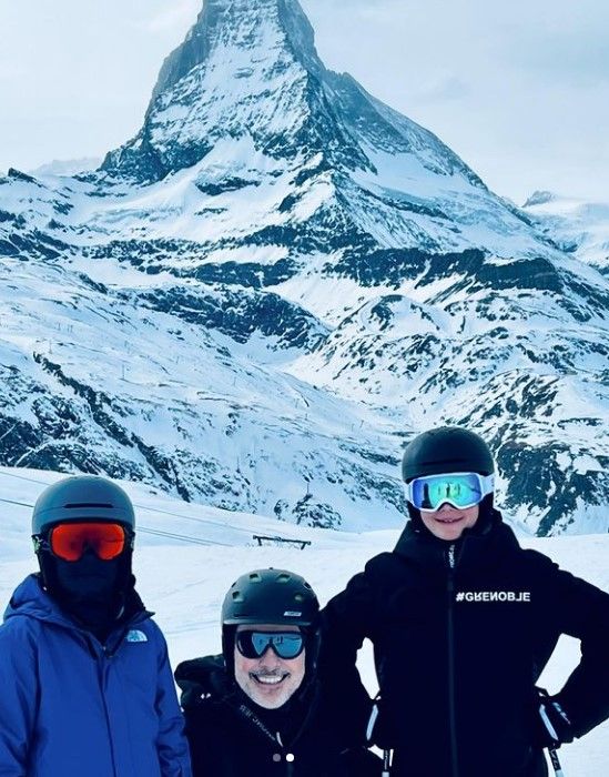 David Furnish with his sons skiing