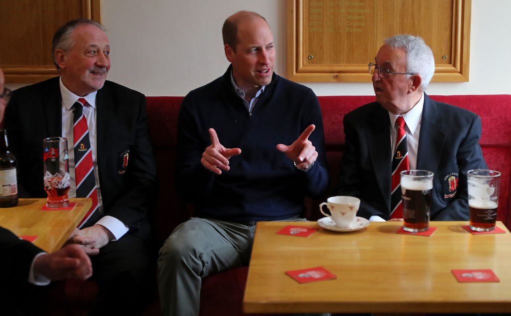 Prince William sat with two old men
