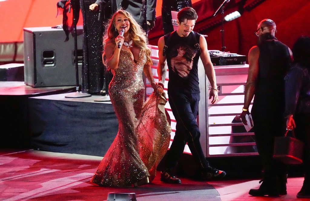 NEW YORK, NEW YORK - SEPTEMBER 24: Mariah Carey, escorted by Bryan Tanaka, performs during the 2022 Global Citizen Festival in Central Park on September 24, 2022 in New York City. (Photo by Gotham/Getty Images)
