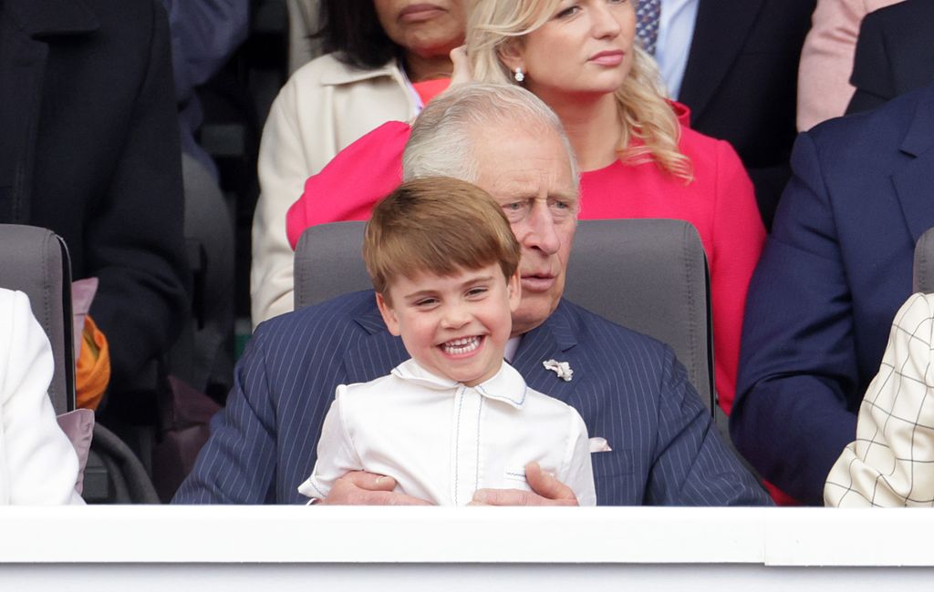 LPrince Louis of Cambridge sits on Prince Charles, Prince of Wales lap during the Platinum Pageant on June 05, 2022 in London