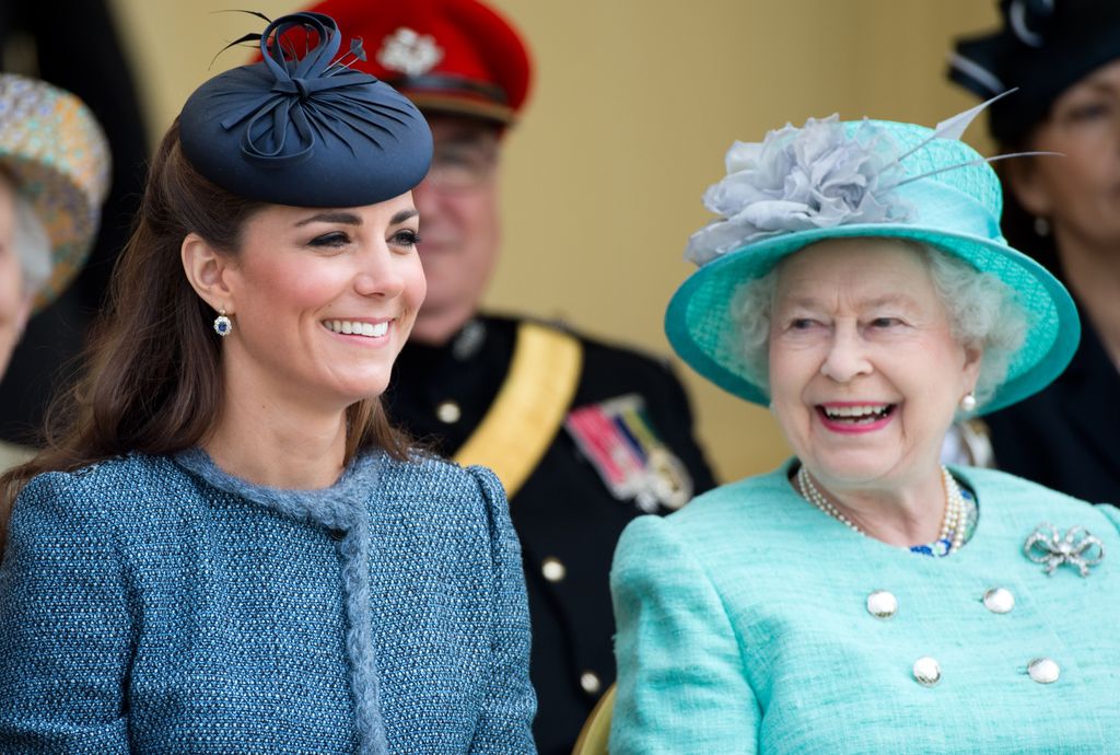 Queen Elizabeth II smiling at Princess Kate
