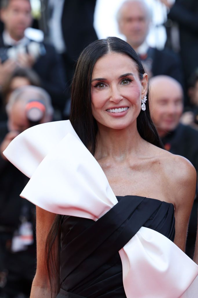 Demi Moore big bow and sleek jet black hair 