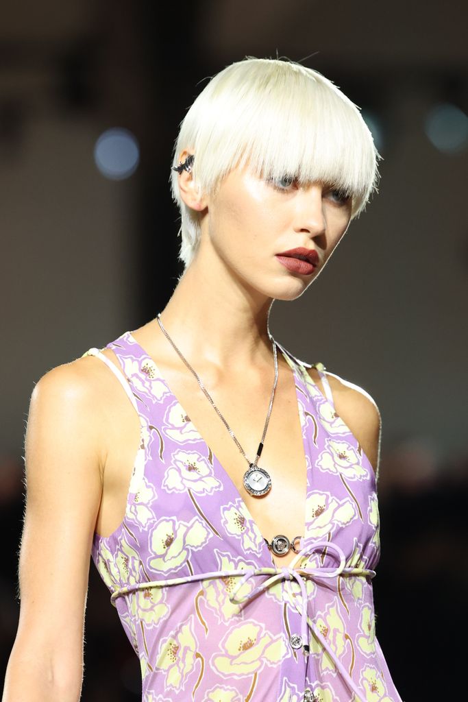 Iris Law walks the runway at the Versace fashion show during the Milan Womenswear Spring/Summer 2025 