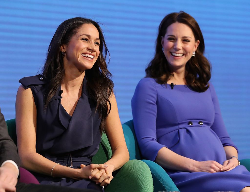 Meghan Markle and a pregnant Kate Middleton laughing