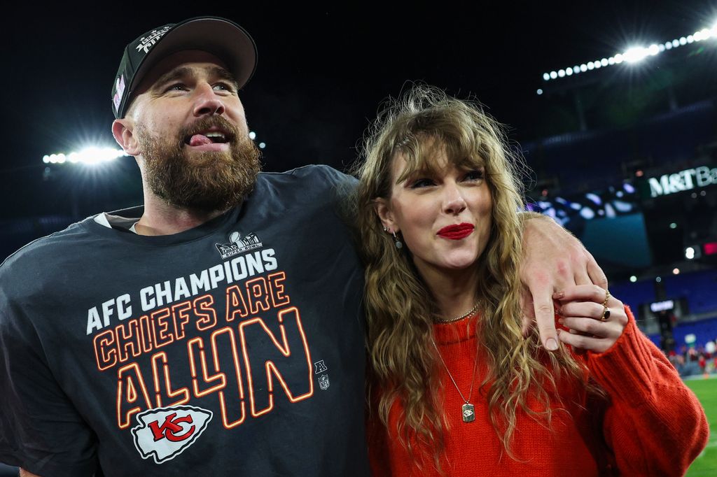 taylor swift travis kelce arms around each other