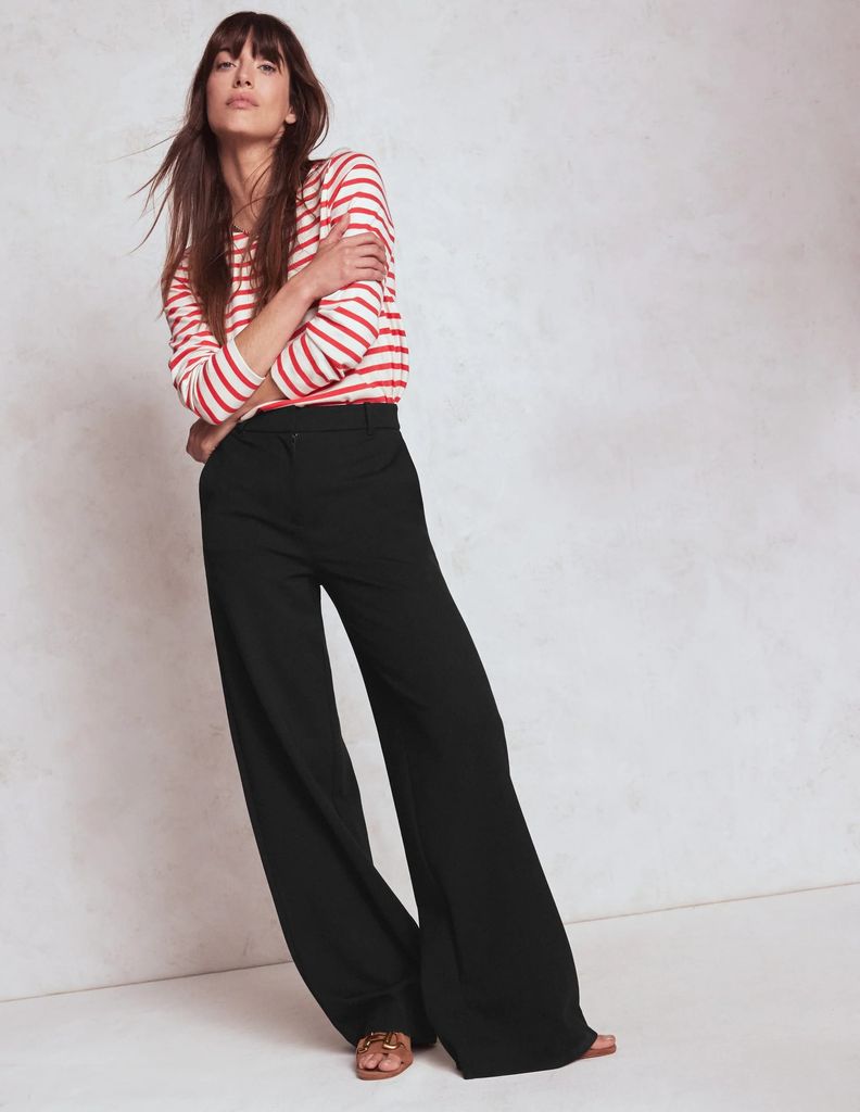 model in smart black trousers