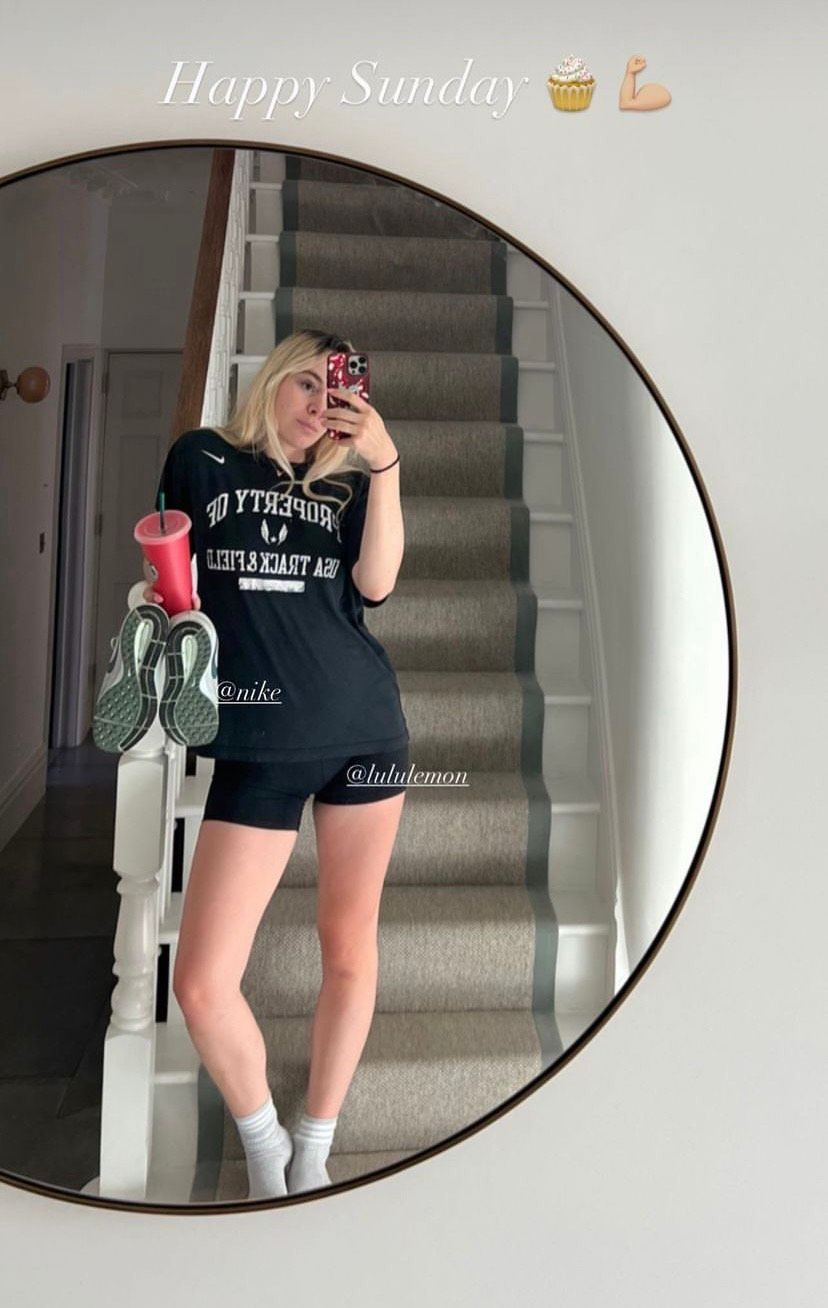 Holly Ramsay wearing black short shorts for a mirror selfie
