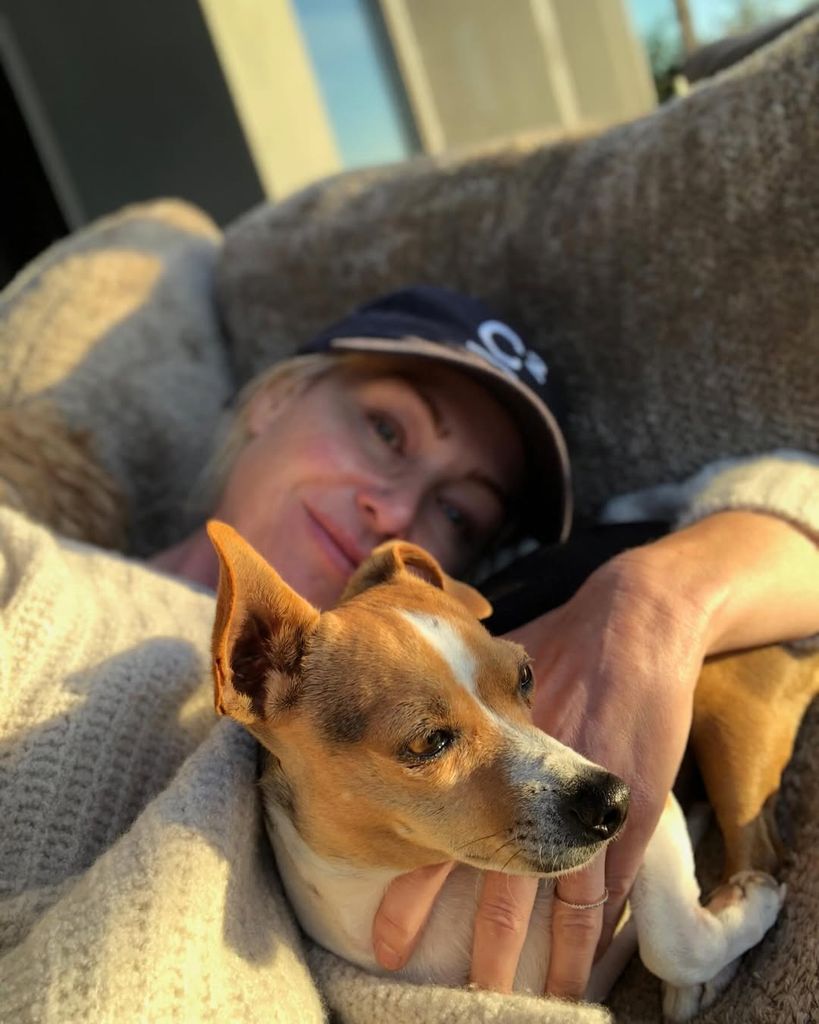 Portia de Rossi sleeps next to her dog Augie in a photo of Ellen Degeneres on Instagram