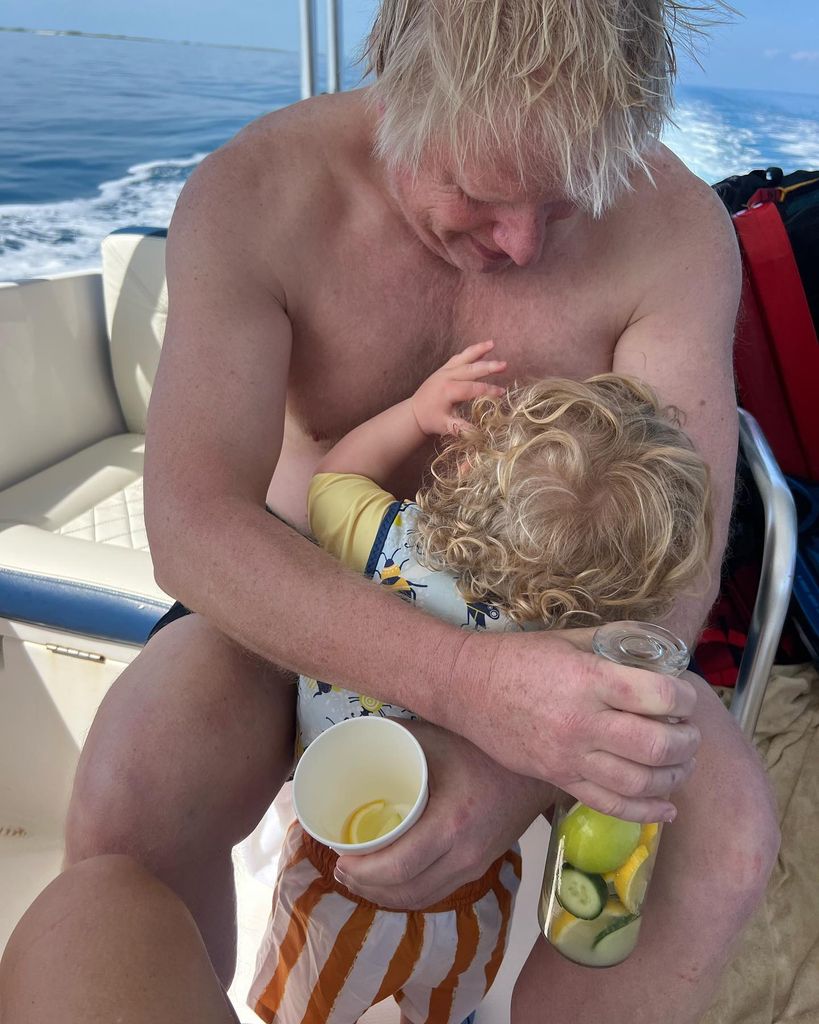 father bonding with son on boat 