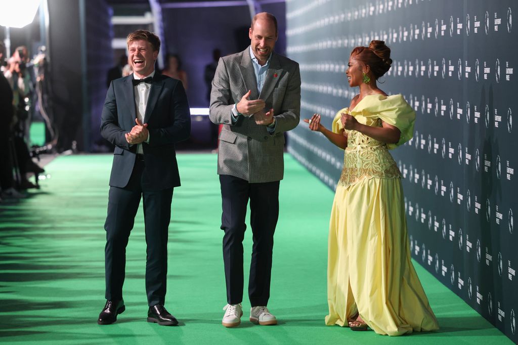 Prince William in a casual outfit on the green carpet