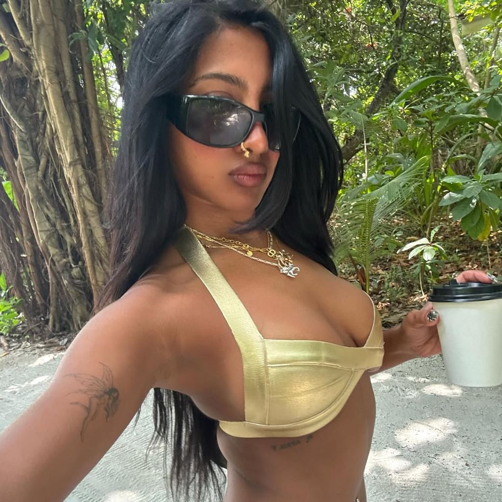 She showed off a gold bikini as well