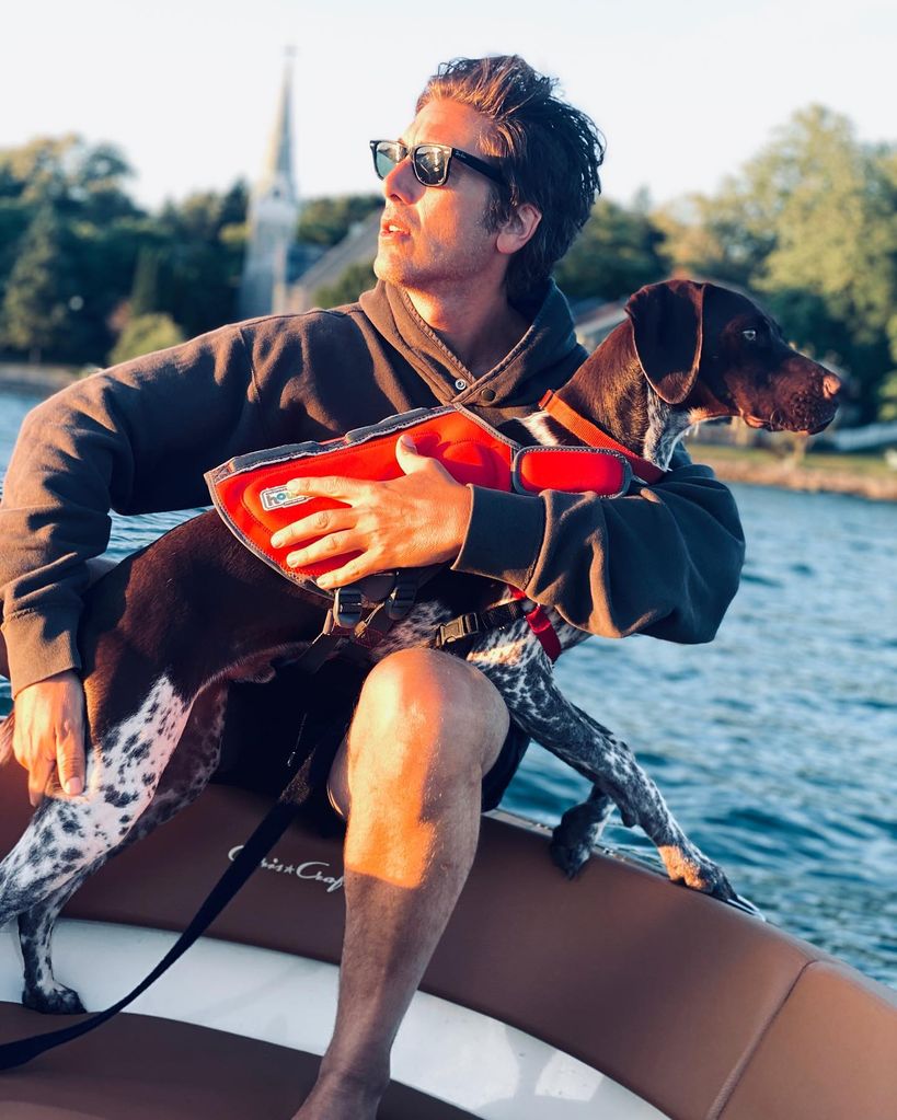 david muir with dog on lake near new york home