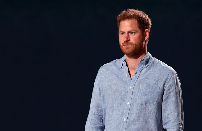 Prince Harry relaxed in a blue shirt