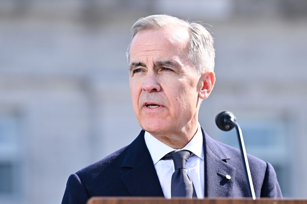 mark carney speaking on stage