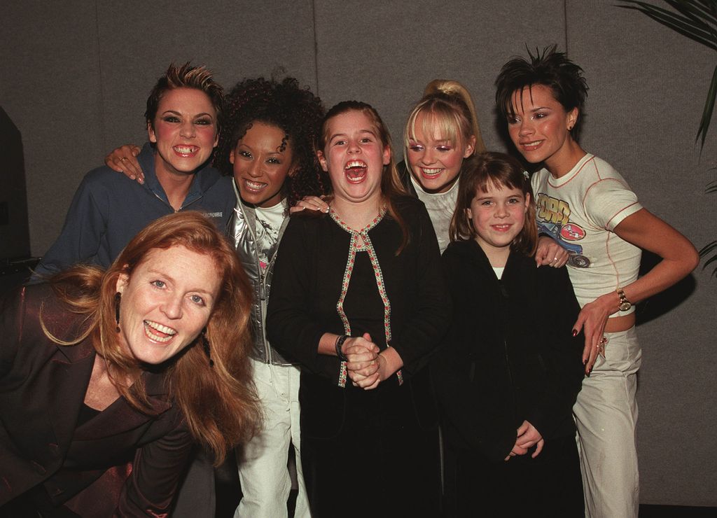 Spice Girls pose with Princess Eugenie, Princess Beatrice and Sarah Ferguson as the royals attend the "Spice Girls" concert at Earls Court Arena on December 15, 1999 in London