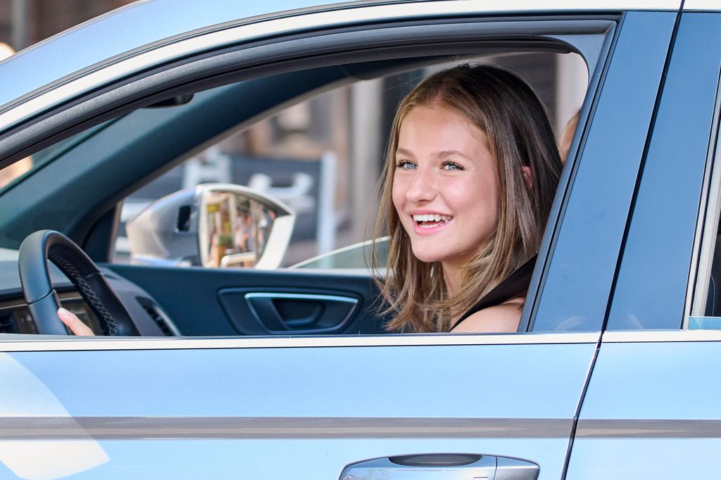 Princess Leonor smiles behind wheel of a car