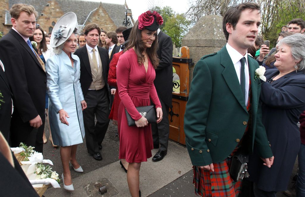 Pippa Middleton in pink dress in crowd of people