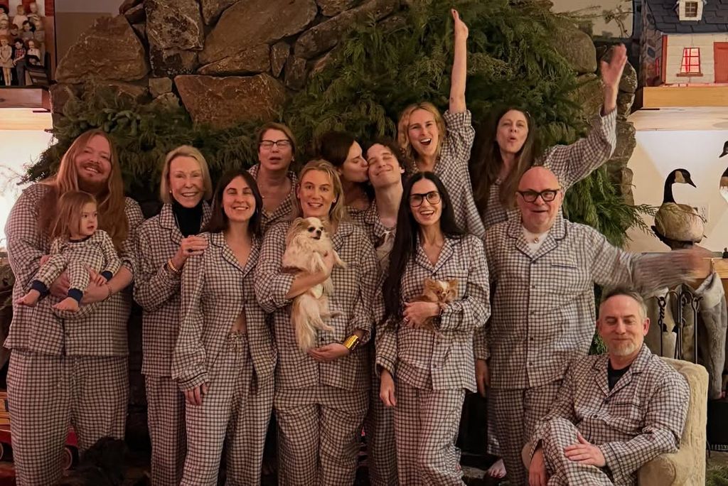 Demi Moore in festive pjs posing with family