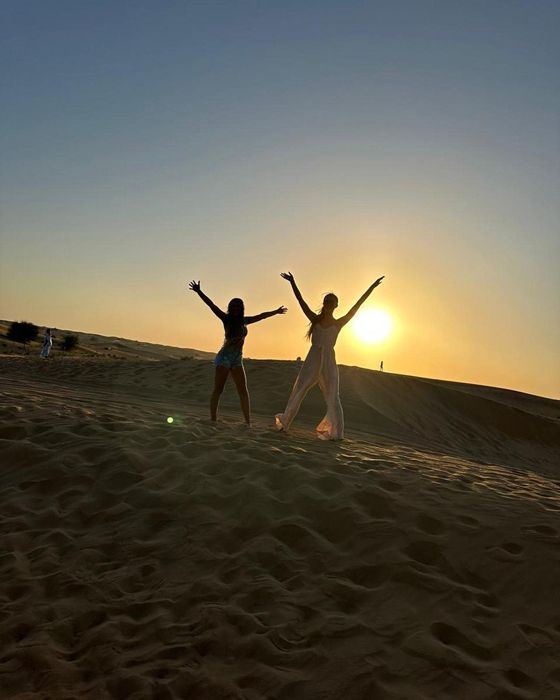 emily and princess andre doing a star jump in Dubai