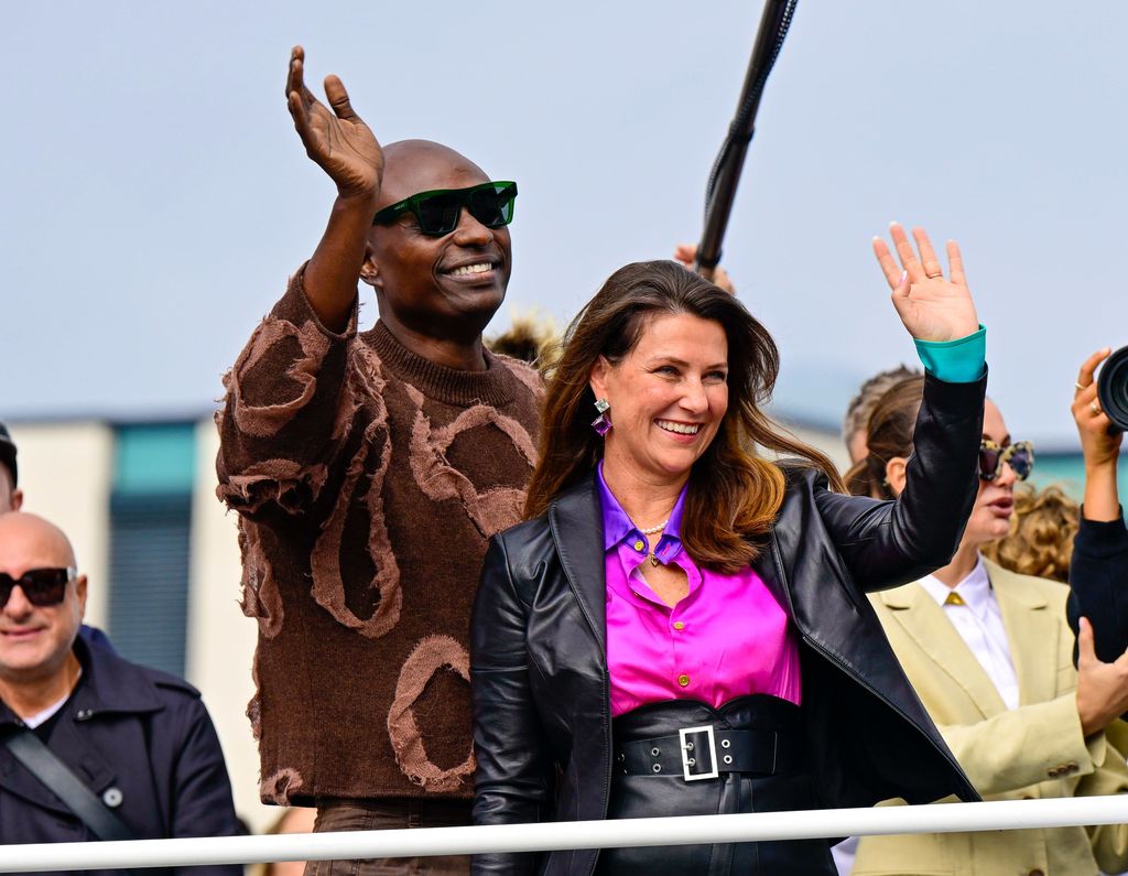 Martha Louise and Durek wave as they board their boat party